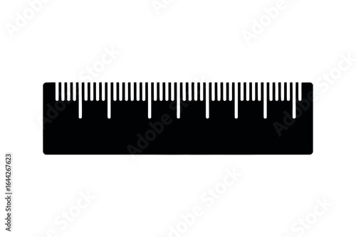 Black ruler with white markings measuring tool