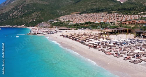Aerial view of beach clubs along the Himare Albanian Riviera coastline on the Ionian Sea in southern Albania beside vlore.