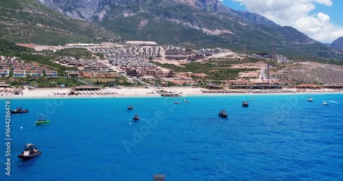Aerial view of beach clubs along the Himare Albanian Riviera coastline on the Ionian Sea in southern Albania beside vlore.