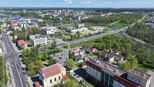 Fototapeta Naklejka Na Ścianę i Meble -  Lida, Grodno region - a typical city of the Republic of Belarus, panoramic view from the top. Modern architecture of small towns in Eastern Europe