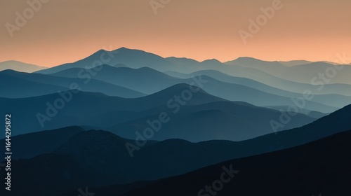 Subtle layered mountain silhouettes under warm evening light.