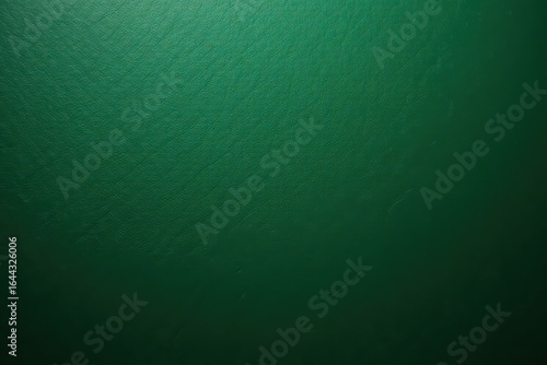 Deep emerald green leather, subtly textured with fine grain , background, close-up