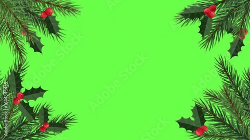 Green screen border frame of Christmas tree branches and holly leaves on bright green background for animation chroma key