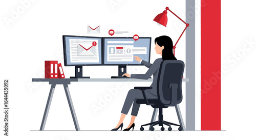 Professional woman working at a modern desk with dual monitors addressing email communication
