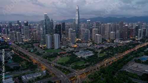 Panoramic view of high buildings and street traffic in Shenzhen city Night view of Shenzhen city