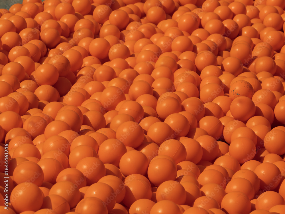 Obraz premium Vibrant Orange Ping Pong Balls Piled Together in Abundance