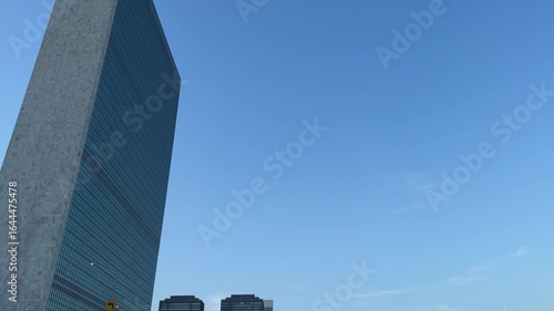 Scenic Manhattan Midtown and East River vista at sunset with the United Nations building in the foreground, New York City