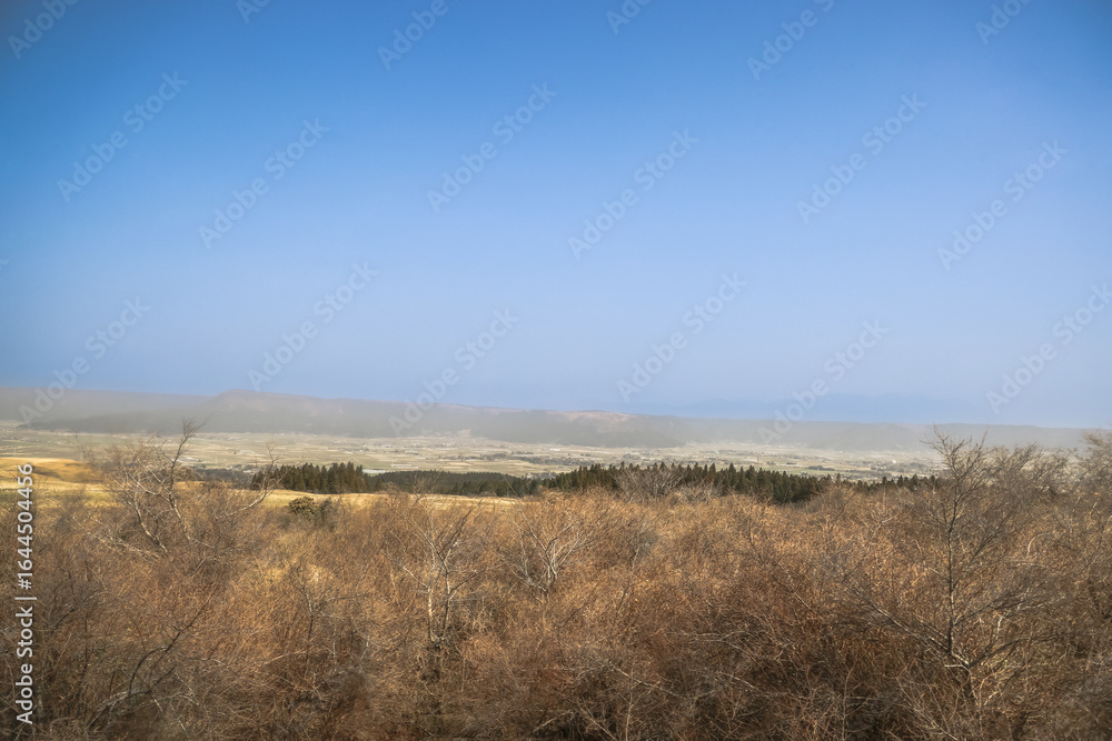 Fototapeta premium March 25 2025 Scenic Landscape with Vast Sky and Peaceful Countryside Fields, Japan