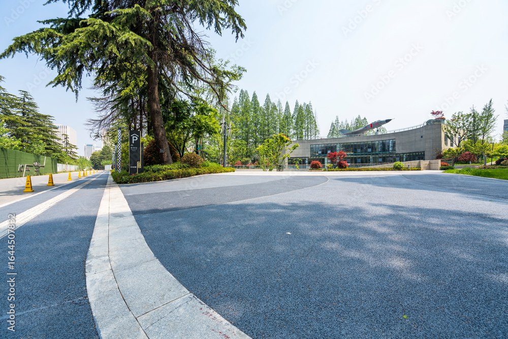 Obraz premium modern business office buildings with empty road,empty concrete square floor 