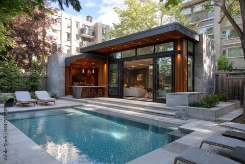 Wallpaper Mural Luxurious backyard with a pool, outdoor kitchen, and a modern patio design. Perfect for advertising real estate or promoting high end outdoor living. Torontodigital.ca