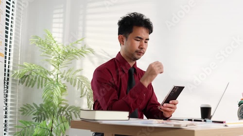 A man is working on a mobile user interface design project. He is focused on the task at hand and appears to be in a creative mood.

