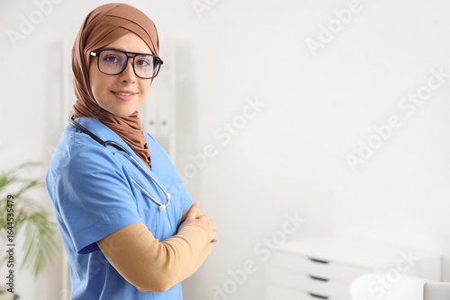 Female Muslim doctor in clinic
