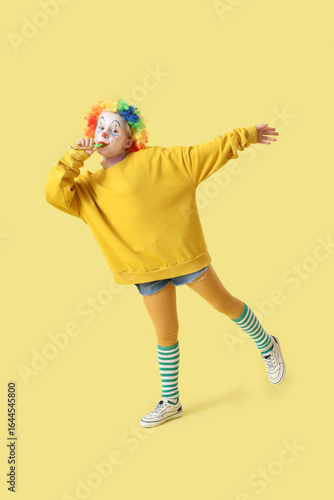 Funny little girl in clown ...