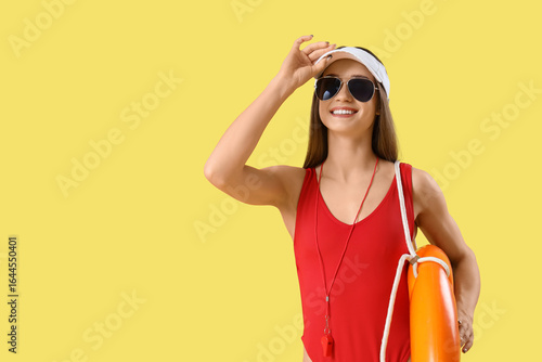 Young female lifeguard in h...