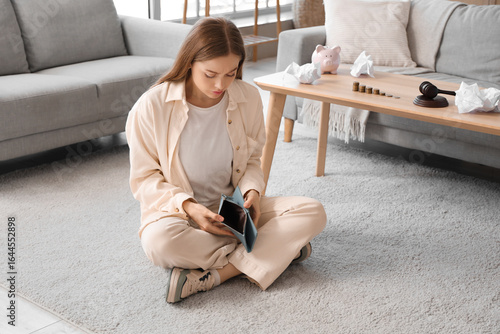 Bankrupt young woman with e...