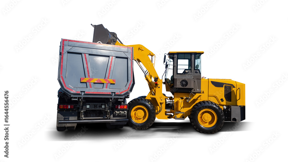 Naklejka premium Construction vehicle. Bulldozer and truck. Road automobile equipment for repair works. Construction technologies. Bulldozer loads truck body. Special construction vehicle on white background.