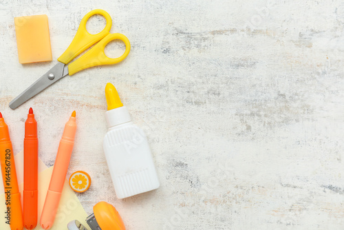 Bottle of glue, scissors an...