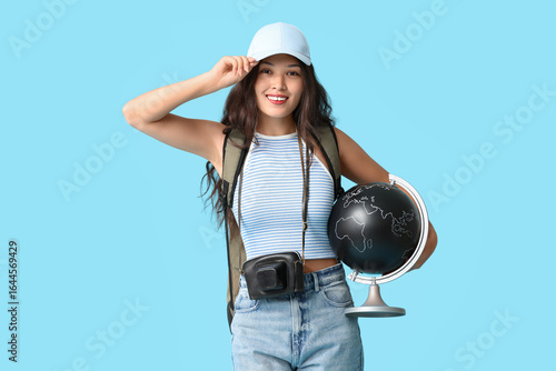 Young Asian woman with glob...