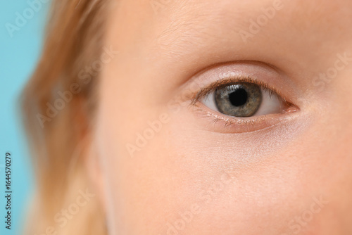 Teenage girl on blue backgr...