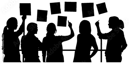 silhouette of team placing sticky notes on wall during brainstorm