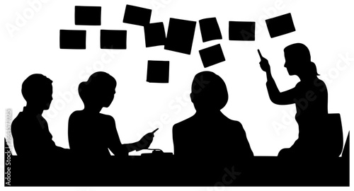 silhouette of team placing sticky notes on wall during brainstorm