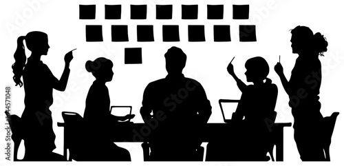 silhouette of team placing sticky notes on wall during brainstorm