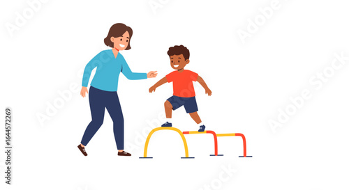 Therapist assists young boy navigating obstacle course.