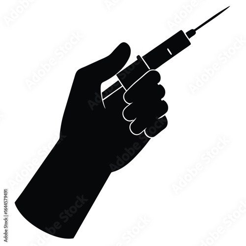 Hand holding medical syringe needle