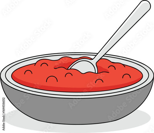 Bowl of Tomato Soup with Spoon