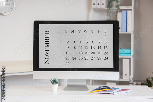 Doctor's workplace with computer monitor with calendar on screen in office