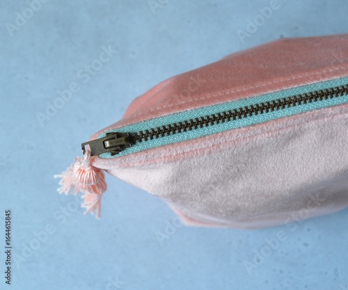 Peach velour metal zipper makeup bag with tassel close up 