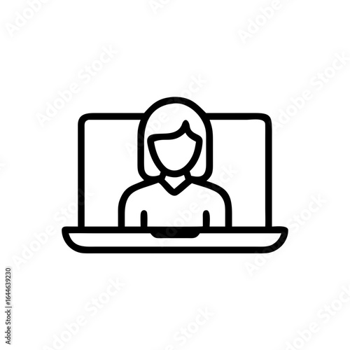 Female professional working on a laptop at a desk with a notepad, potted plant, and warm lighting.