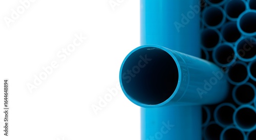 Detailed macro view of a blue plastic pipe connection with a bundle of smaller tubes for an industrial plumbing system