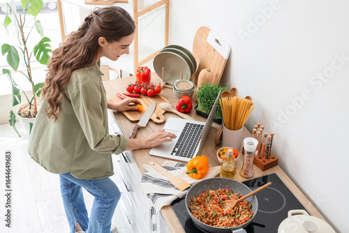 Young woman with laptop cut...