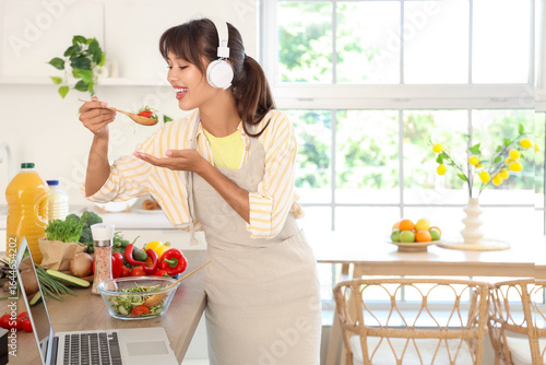Young woman with headphones...