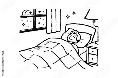 Man reading a book in bed under a patterned blanket