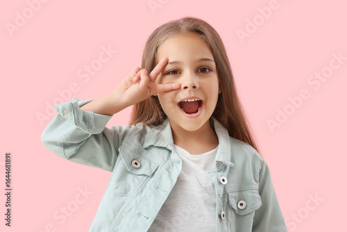 Cute little girl showing vi...