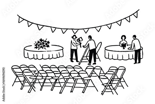 Event setup crew arranging chairs and tables for a conference or meeting