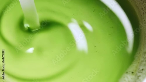 Wallpaper Mural fresh green smoothie, fresh green tea, pouring milk into a glass, green tea splash, matcha, whisk Torontodigital.ca