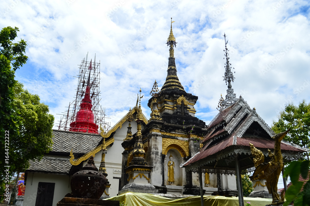 Fototapeta premium Pagoda and Church, Lanna Architecture, Symbols of Buddhism, South East Asia at Wat Phra That (Doi Noi), Chulakiri, Chiang Mai, Northern Thailand
