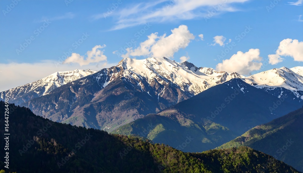 Majestic mountain range under a blue sky Majestic mountain range under a blue sky