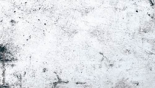White textured background with scattered dark gray scratches, speckles, and smudges; showing signs of wear and age