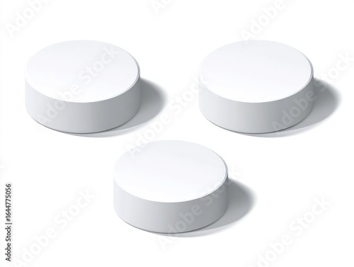 Three simple, white, round podiums against a white background