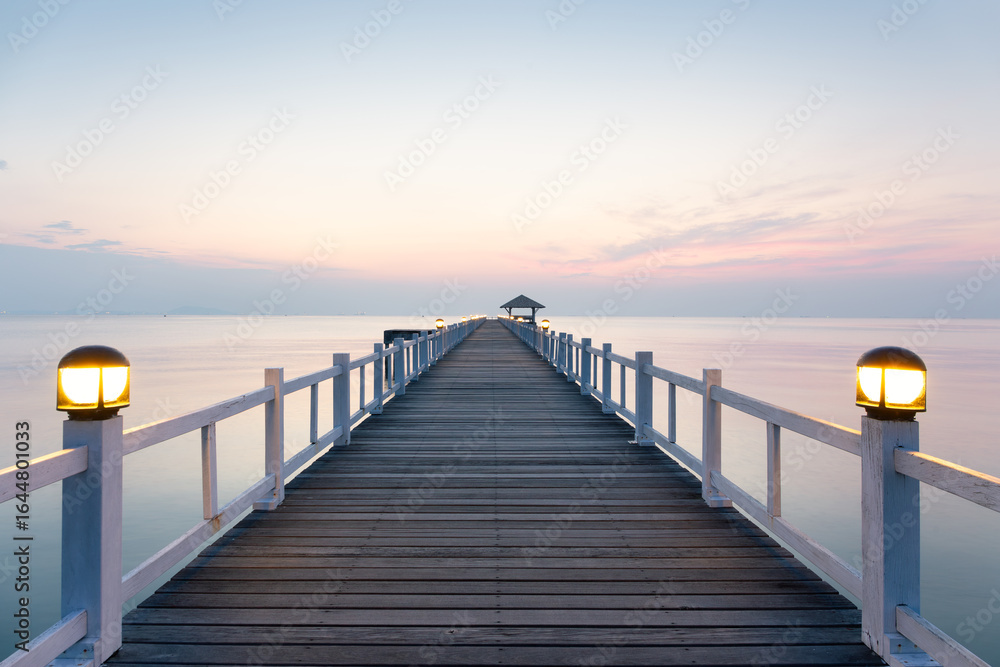 Obraz premium Coastal landscape in Chonburi, Thailand. Serene travel destination. Nature meets architectural engineering. Evening sky reflects on sea. Ideal for tourism, scenic beauty and vacation concept.