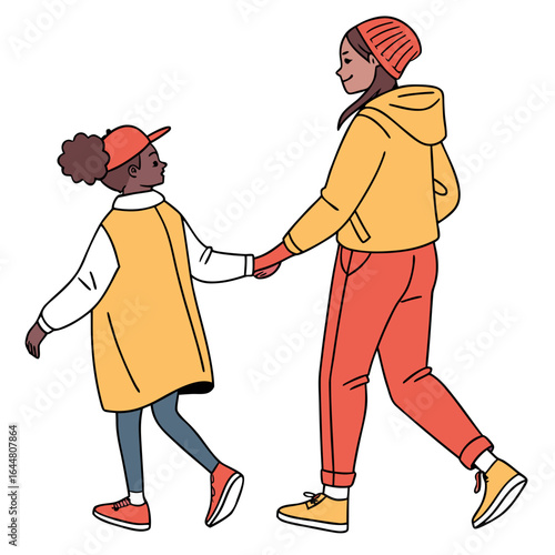 Two young girls of different ethnicities holding hands and walking together in casual winter clothing enjoying a shared moment outdoors