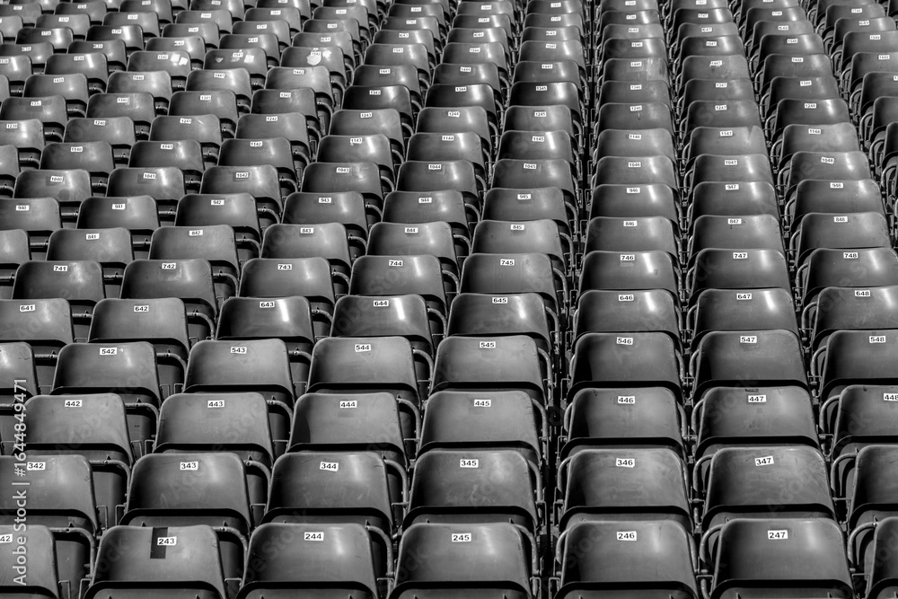 Fototapeta premium Plastic chairs with numbers on the tribune