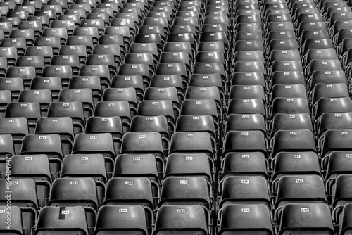 Plastic chairs with numbers on the tribune