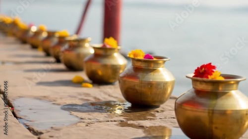 Golden Pots Adorned with Flowers Line Riverbank in Serene Ritualistic Scene