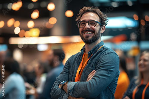 Startup business owner presenting at trade show. Group of people enjoying event. Lively atmosphere inside exhibition hall. Successful business concept. Copy space, Banner	