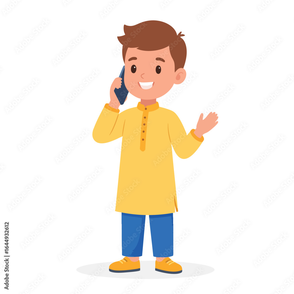 Obraz premium A young boy in a yellow kurta talking on a smartphone, gesturing with his hand.